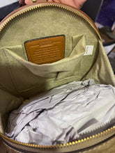 Signature Round Sling Bag