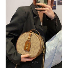Signature Round Sling Bag