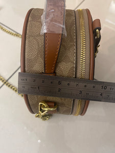 Signature Round Sling Bag